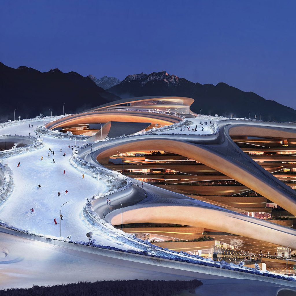 Aedas’ Trojena Ski Village with terraced mixed‑use volumes and integrated ski slopes in a mountainous desert landscape in Saudi Arabia. Aerial dusk view of Aedas’s Trojena Ski Village showing terraced mixed‑use structures embedded into a mountain setting. Curvilinear roof decks and layered podiums integrate ski slopes and pedestrian paths. The architecture uses continuous horizontal slabs, large glazed openings, and integrated lighting, forming a year‑round alpine resort within NEOM’s high‑altitude desert terrain.