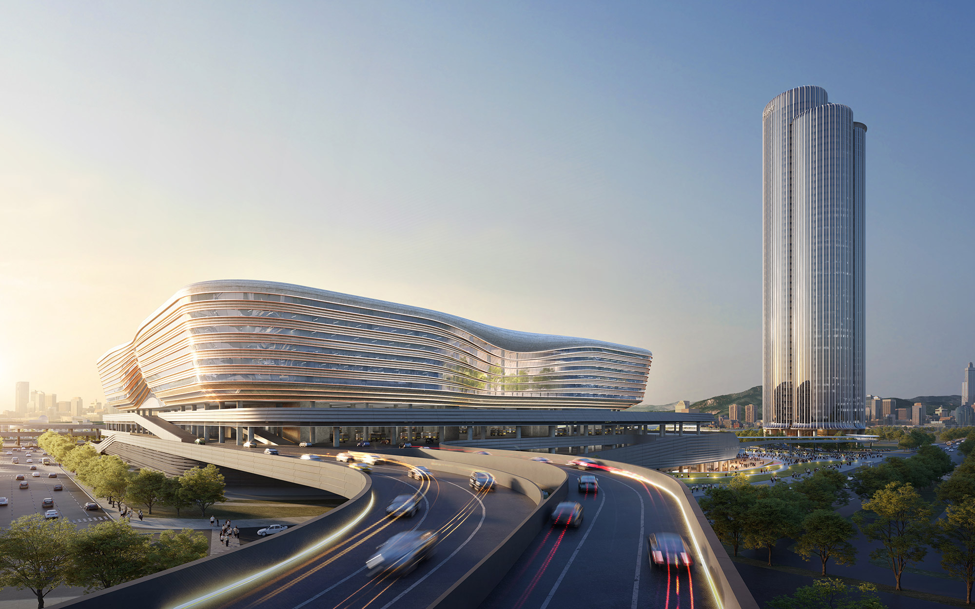 Aedas’ Huanggang Port gateway with layered wave‑form roof, stacked transport decks and integrated border‑crossing halls. Aerial oblique view of Aedas’ Huanggang Port New Development showing a low‑rise terminal volume with a continuous wave‑form roof above multi‑level transportation decks. Elevated roadways curve through the structure to separate traffic flows. A slender high‑rise tower rises adjacent to the port complex, integrating immigration halls, public space and urban infrastructure.