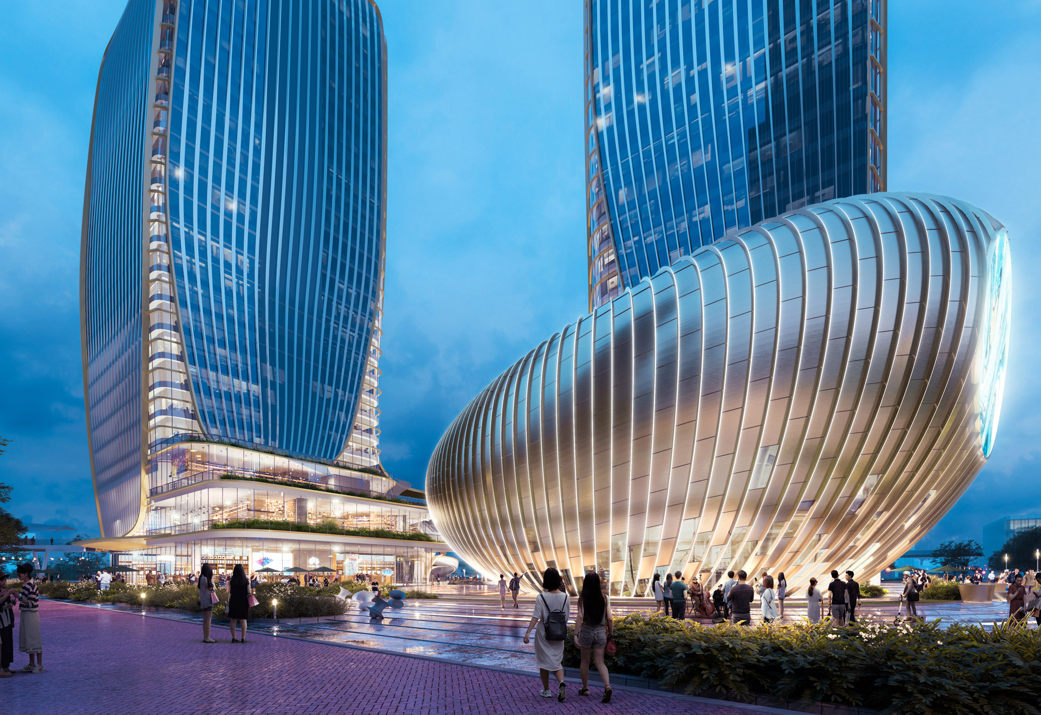 Aedas’ Jing Brand Wuhan development with twin glazed towers above a sculpted retail podium and public plaza. Evening ground‑level view of the Aedas‑designed Jing Brand development in Wuhan, showing two high‑rise glass towers rising from a curvilinear, multi‑storey retail podium. The podium features floor‑to‑ceiling glazing, layered horizontal fins and a central atrium volume opening onto a landscaped pedestrian plaza with integrated lighting and circulation.