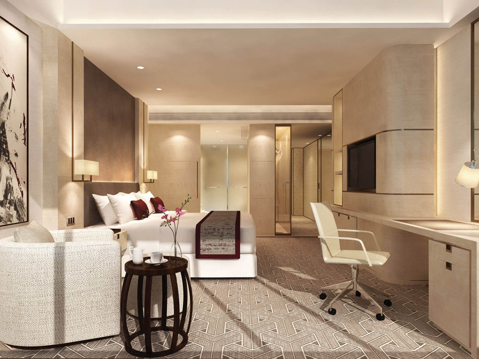 Aedas Interiors’ Langham Place Hotel Datong is shown as a refined guestroom interior with calm neutral tones, soft stone wall panels, dark timber accents, and patterned carpeting. The image highlights a contemporary hospitality space that blends modern luxury with subtle references to Shanxi heritage through minimalist forms, balanced proportions, and understated traditional motifs integrated into furniture and finishes.