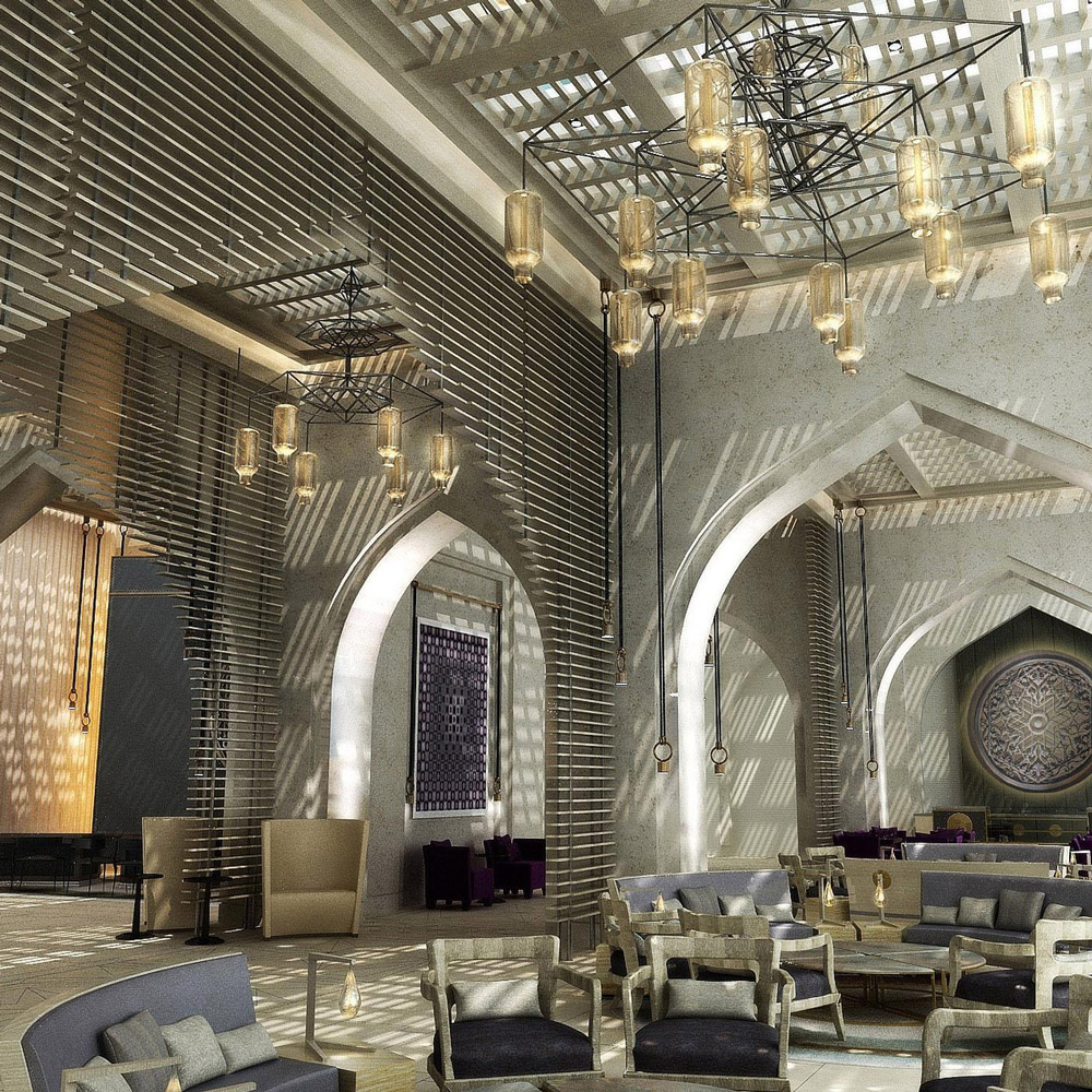 Aedas Interiors’ proposed Jumeirah Saraya Bandar Jissah Resort 2 in Muscat is shown as a light‑filled resort lounge with arched architectural frames, layered stone textures, patterned metal screens, and suspended lantern lighting. The image highlights a contemporary luxury hospitality interior where Omani craft influences, soft neutral tones, and filtered daylight create a refined sense of place inspired by coastal, garden, and mountainous landscapes.