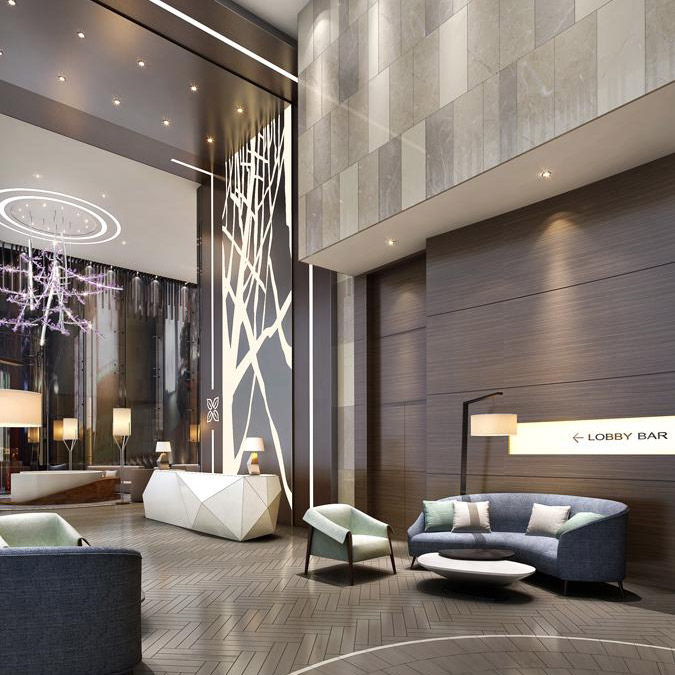 Aedas Interiors’ Hilton Garden Inn Mongkok lobby is shown as a serene, double‑height arrival space with a sculptural two‑storey feature wall, geometric reception desk, and circular lounge seating positioned against full‑height curtainwall glazing. The image highlights calm, garden‑inspired hospitality interiors using neutral tones, sleek furniture, and layered lighting to create a restful urban retreat within a dense city context.