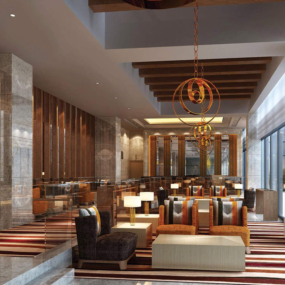 Aedas Interiors’ DoubleTree by Hilton Yongkang is shown as a warmly lit hotel lounge featuring stone‑clad columns, timber‑lined walls, striped carpeting, and sculptural metal pendant installations. The image highlights a contemporary hospitality interior that blends light timber, natural stone, and bespoke metal art, creating a refined yet welcoming environment reflecting local identity and home‑like comfort.