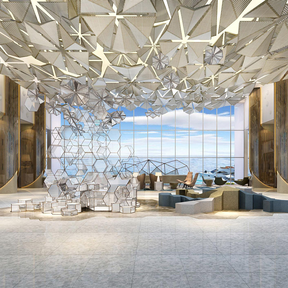 Aedas Interiors’ Proposed 5‑Star Urban Resort in the Middle East is shown as a grand, open lobby with a geometric sculptural ceiling installation, polygonal metallic elements, and expansive floor‑to‑ceiling glazing overlooking water. The image highlights a luxurious hospitality interior combining parametric design, natural light, refined stone finishes, and flexible lounge seating to create a dramatic resort arrival experience.