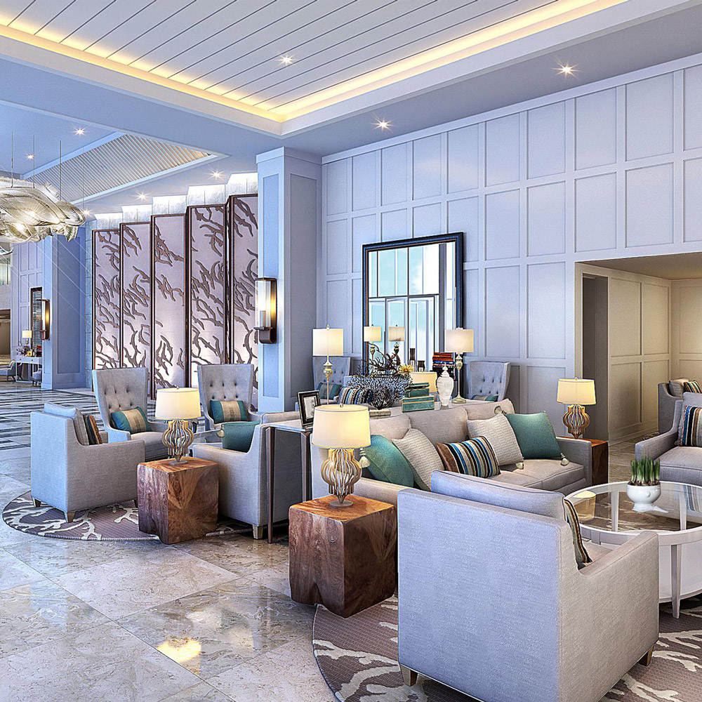 Aedas Interiors’ The Langham, Palm Jumeirah is shown as an elegant resort lobby lounge with soft blue and sand‑toned upholstery, sculptural metallic chandeliers, patterned stone flooring, and paneled walls. The image highlights a refined ocean‑inspired hospitality interior blending coastal colour palettes with Middle Eastern detailing, layered seating clusters, and generous circulation to create a relaxed yet formal luxury arrival space.