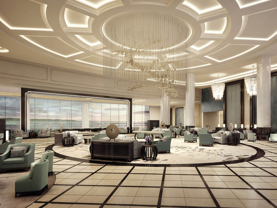 Aedas Interiors’ Radisson Blu Hotel Wuhan ETD Zone is shown as a grand lobby lounge with a dramatic circular chandelier installation, layered cove‑lit ceiling, polished stone flooring, and symmetrically arranged lounge seating. The image highlights an elegant five‑star hospitality interior that combines generous scale, refined lighting, and calm seating zones, framed by panoramic window walls overlooking the lakeside setting.