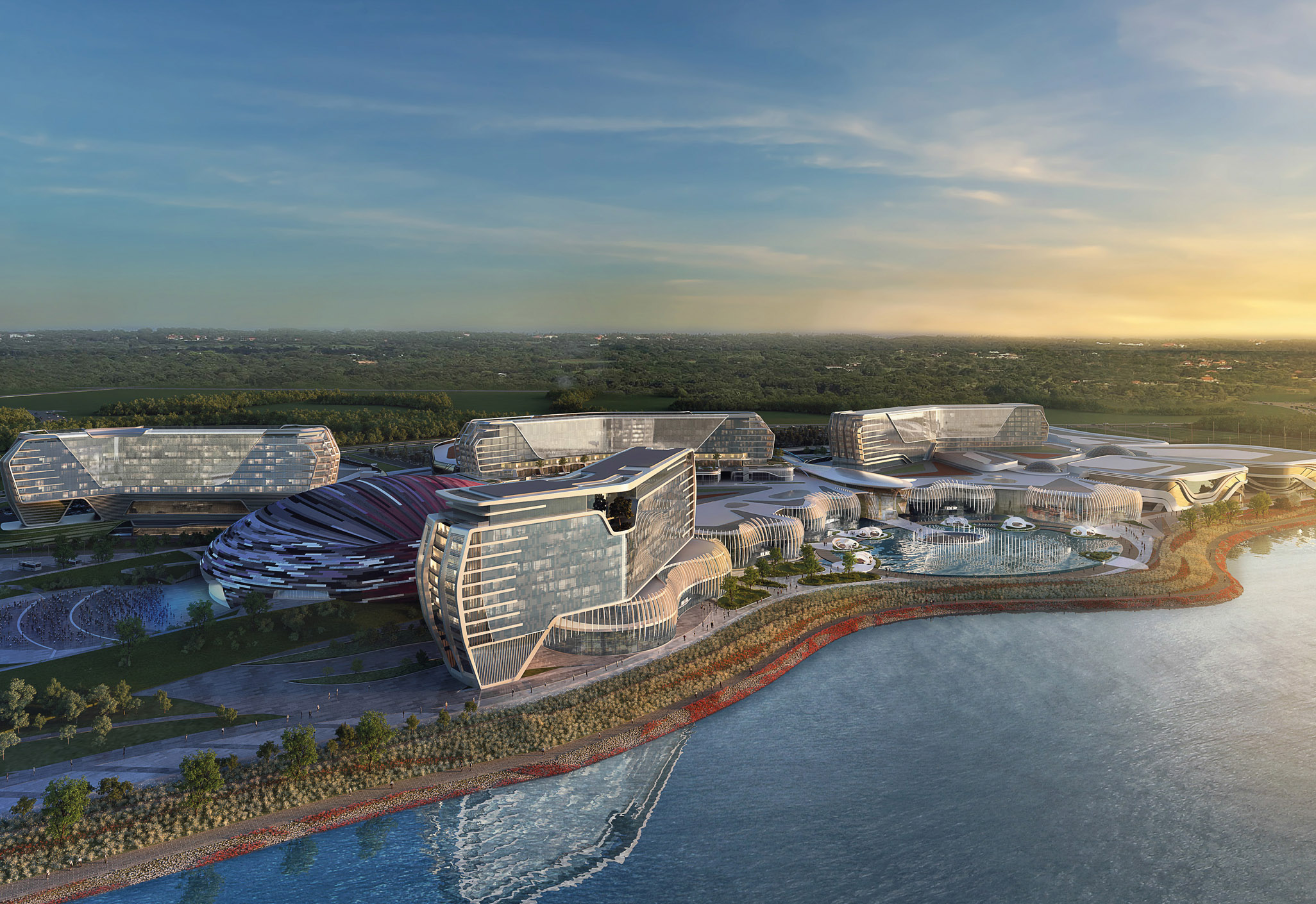 Aedas’s Inspire Integrated Resort in Incheon is shown as a large-scale waterfront development composed of multiple sculpted hotel volumes, curved podium structures, and extensive landscaped terraces. The aerial view highlights horizontal resort massing, glazed façades, and integration of water features and public circulation within a coastal setting.