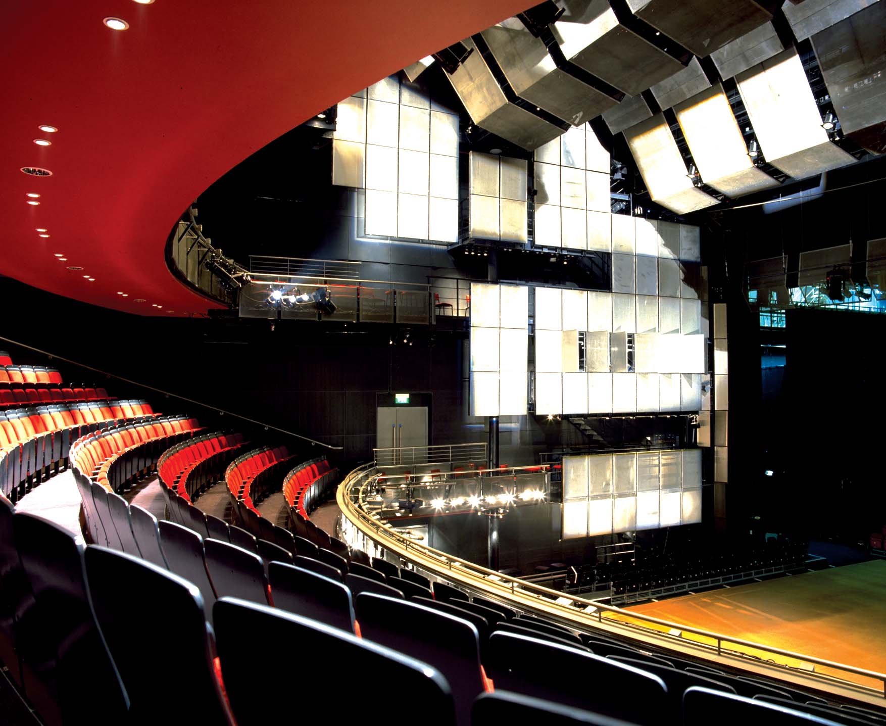 Aedas’s Sadler’s Wells Theatre in London is shown as a contemporary performance architecture defined by a curved auditorium geometry, tiered seating structure, and suspended acoustic panel system. The image highlights performance‑led building volume, integrated technical architecture, and controlled enclosure suited to large‑scale dance and theatre production.