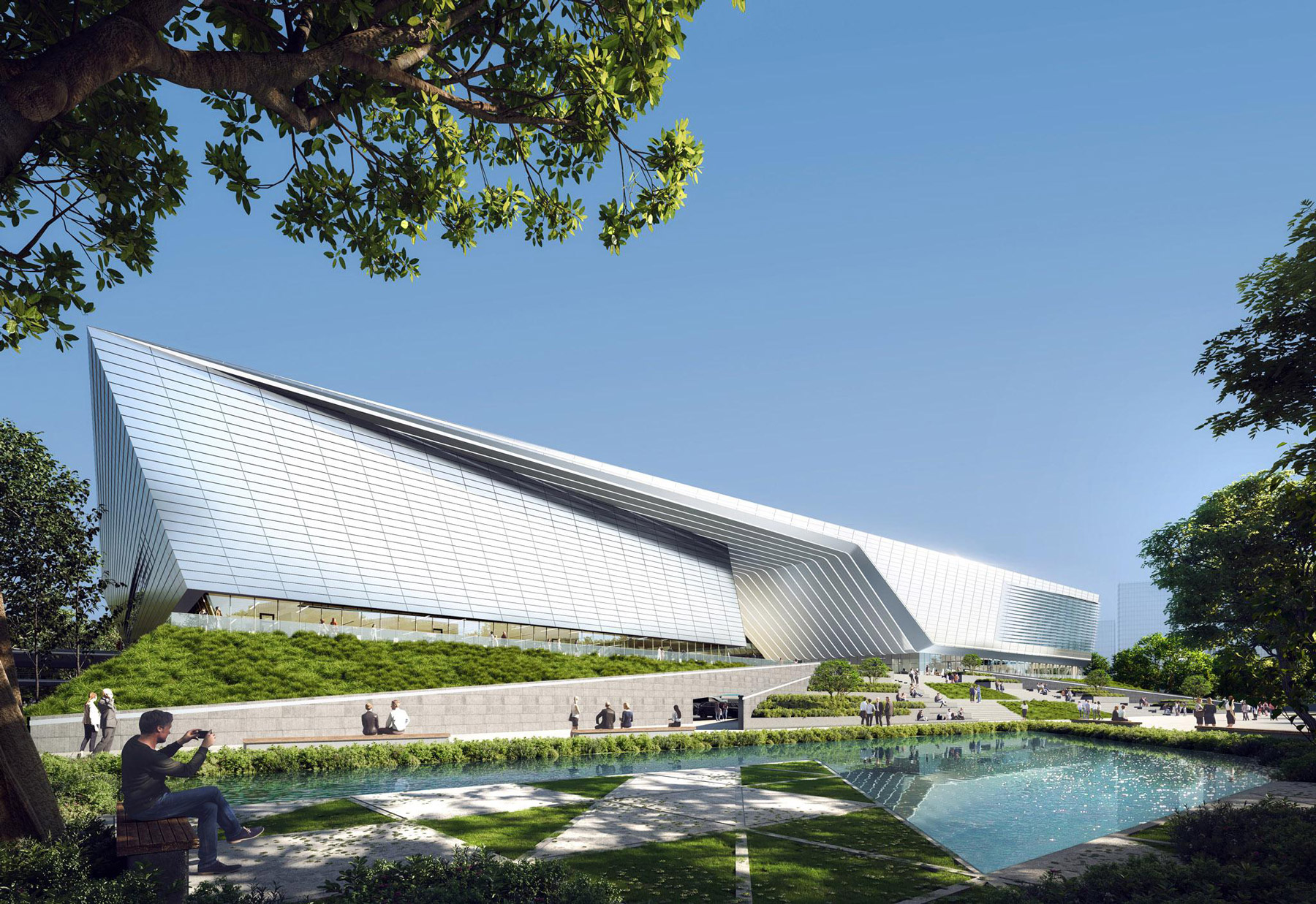 Aedas’ Zhuhai Hi‑Tech Industrial Development Zone Sports Center and Water Purification Plant Phase II is shown as a sculptural civic complex with a sharply faceted, metallic‑clad sports hall rising above landscaped water gardens. The image highlights dynamic, canoe‑like roof forms, reflective pools, and integrated green spaces, expressing a powerful “sailing on sea” concept where above‑ground public sports facilities are seamlessly layered over critical underground water‑treatment infrastructure to create a sustainable urban landmark. Provide your feedback on BizChat