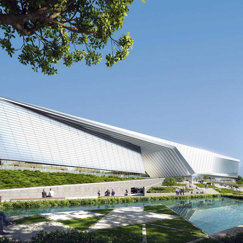 Aedas’ Zhuhai Hi‑Tech Industrial Development Zone Sports Center and Water Purification Plant Phase II is shown as a sculptural civic complex with a sharply faceted, metallic‑clad sports hall rising above landscaped water gardens. The image highlights dynamic, canoe‑like roof forms, reflective pools, and integrated green spaces, expressing a powerful “sailing on sea” concept where above‑ground public sports facilities are seamlessly layered over critical underground water‑treatment infrastructure to create a sustainable urban landmark. Provide your feedback on BizChat