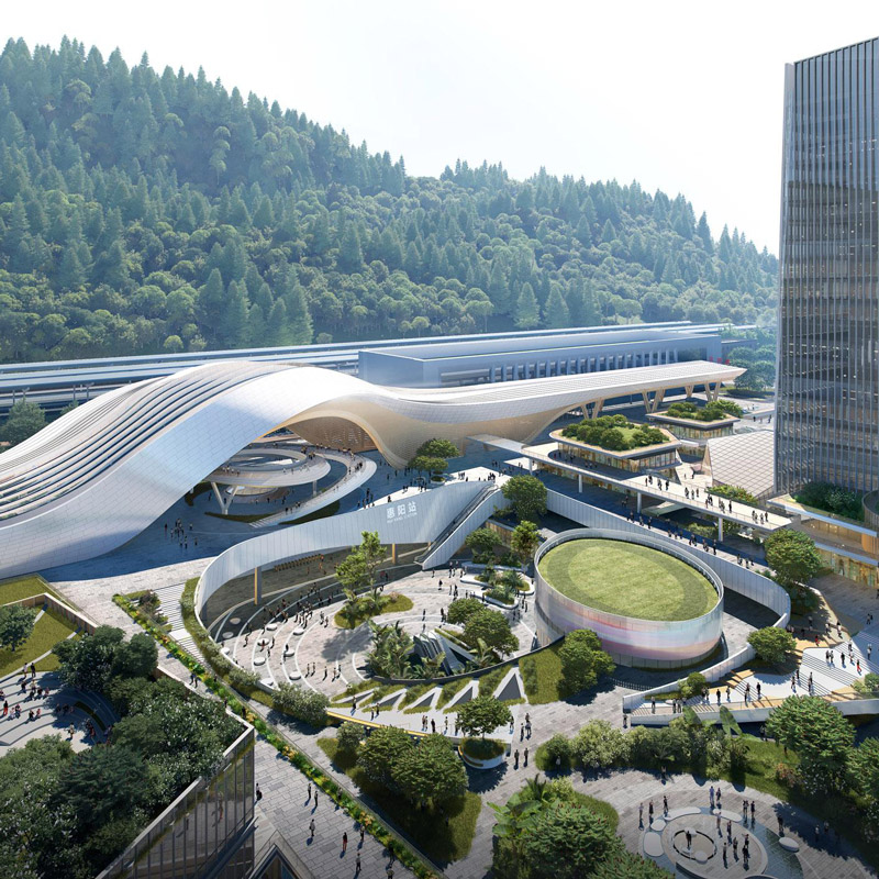 Aedas’ Huiyang Station–City Integrated Comprehensive Development in Huizhou is shown as a landmark transit‑oriented masterplan with a fluid, sculptural railway hub roof, elevated pedestrian decks, and surrounding high‑rise mixed‑use plots. The image highlights seamless integration of rail infrastructure, commercial towers, public plazas, and landscaped green spaces to form a self‑sustaining station‑city ecosystem that supports work, living, leisure, and exhibition functions at the metropolitan edge of Shenzhen.