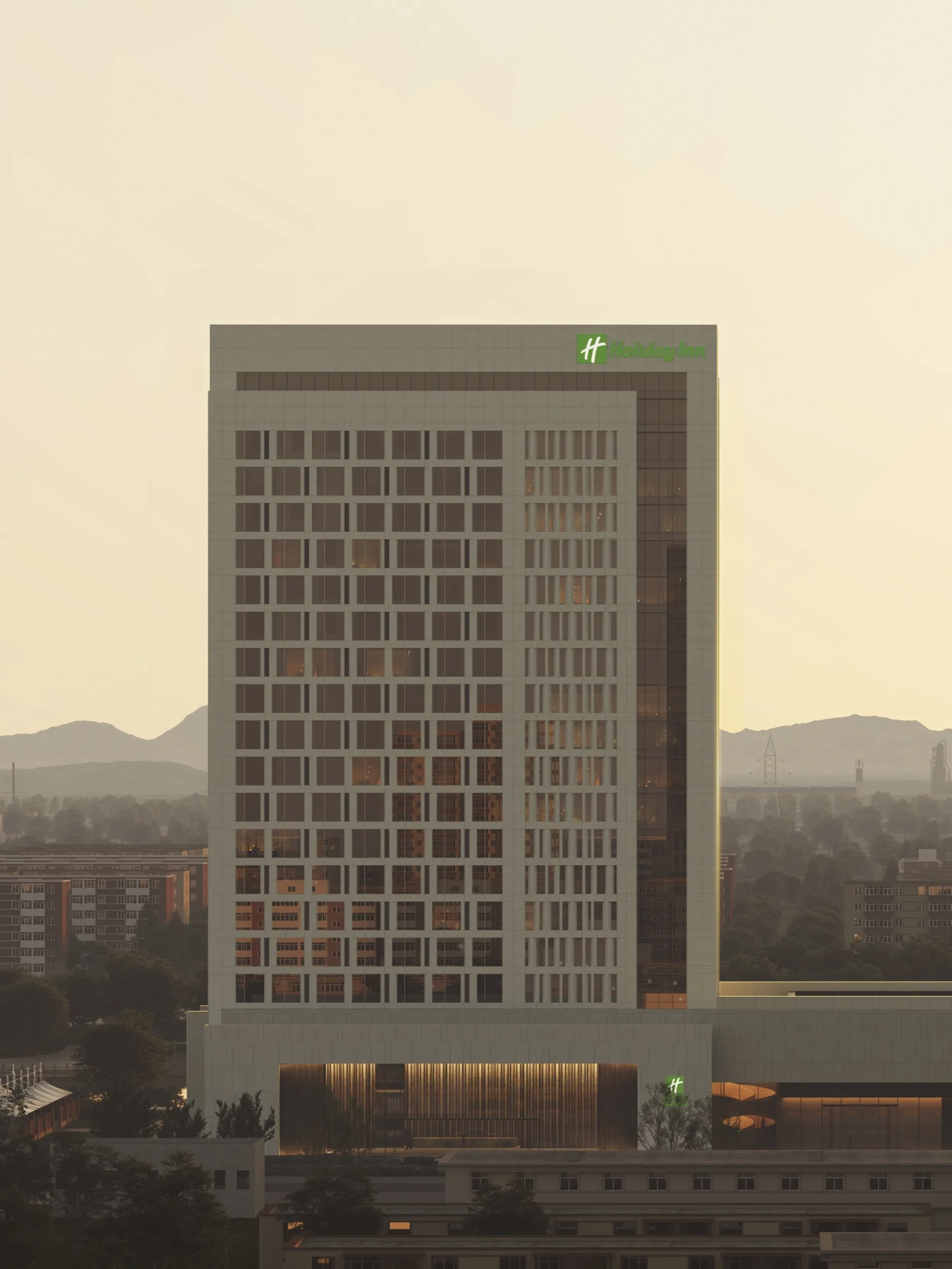 Aedas’ CGDG Xinjiang Beautiful China Resort Kuitun Holiday Inn Hotel is shown as a contemporary mid‑rise hotel tower rising from a horizontally layered podium facing an urban waterfront. The image highlights a restrained, rectilinear façade with a regular window grid, warm recessed podium lighting, and landscaped foreground spaces that establish the building as an open, civic‑oriented hospitality landmark, recalling the welcoming posture of historic Silk Road inns while anchoring a modern city living room.