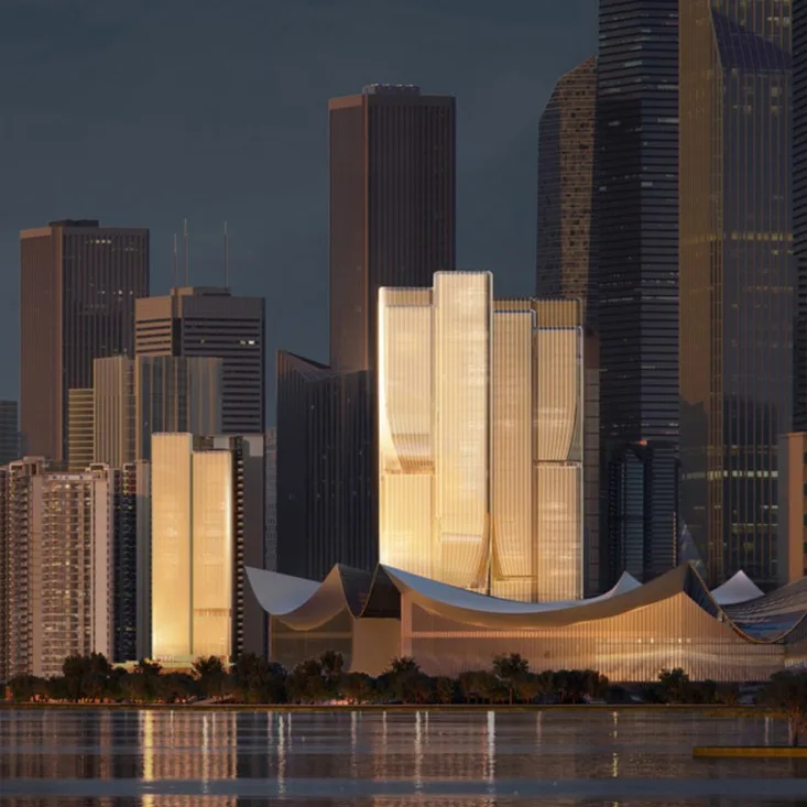 Aedas’ Hengli Island Plot 2021NJY‑12 Mixed‑use Project in Guangzhou is shown as an iconic waterfront commercial landmark with sculptural twin towers clad in champagne‑toned glass rising from a fluid podium. The image highlights organically contoured massing inspired by magnolia blossoms and waves, illuminated façades reflecting sea and sky, and layered podium forms integrating Lingnan‑influenced public spaces, retail, and landscaped terraces, establishing a refined financial‑island skyline presence.
